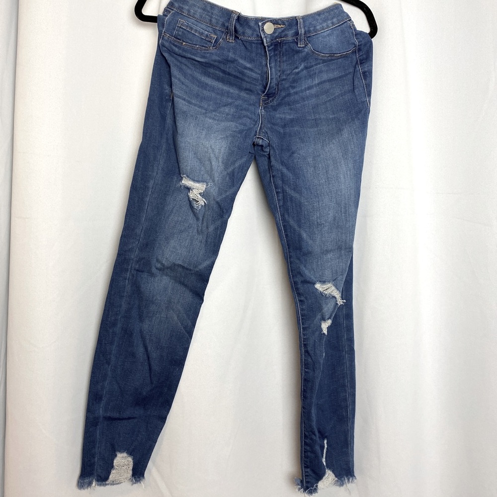 Mid-rise ripped skinny jeans